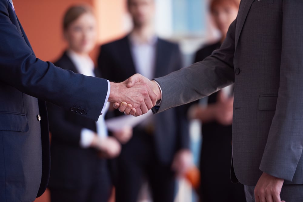 business partners, partnership concept with two businessman handshake-1